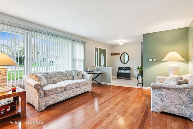403 E Amherst St, Palatine, IL 60074 - living room with baseboards, wood finished floors, and a healthy amount of sunlight