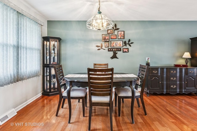 403 E Amherst St, Palatine, IL 60074 - dining space featuring baseboards, a notable chandelier, wood finished floors, and visible vents