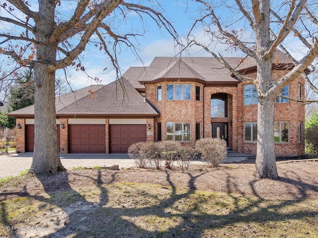 14320 Claridge Ct, Orland Park, IL 60462 - view of front facade featuring a garage, brick siding, driveway, and a shingled roof
