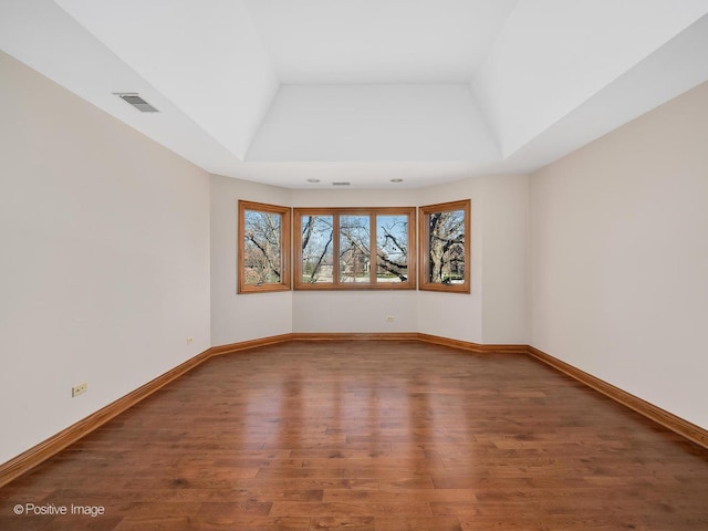 14320 Claridge Ct, Orland Park, IL 60462 - empty room with a raised ceiling, wood finished floors, baseboards, and visible vents