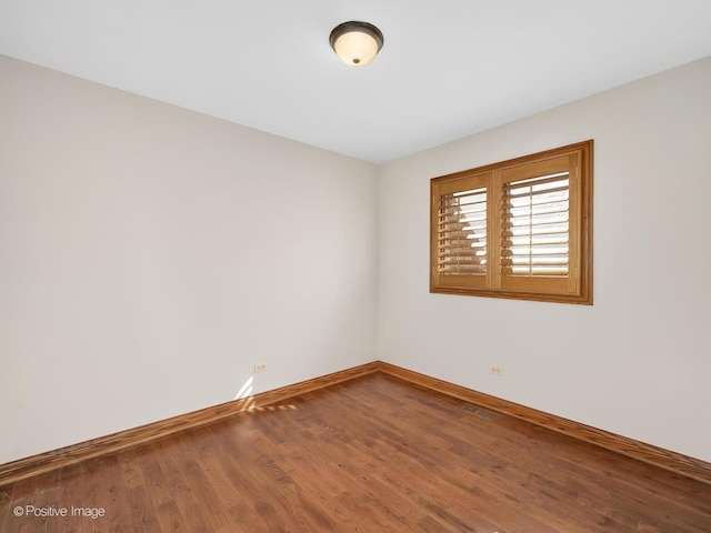 14320 Claridge Ct, Orland Park, IL 60462 - empty room featuring baseboards and wood finished floors