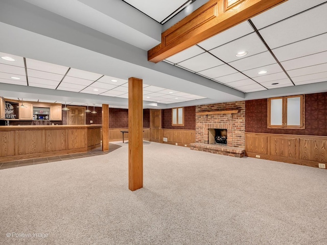 14320 Claridge Ct, Orland Park, IL 60462 - basement featuring carpet flooring, a drop ceiling, and a brick fireplace