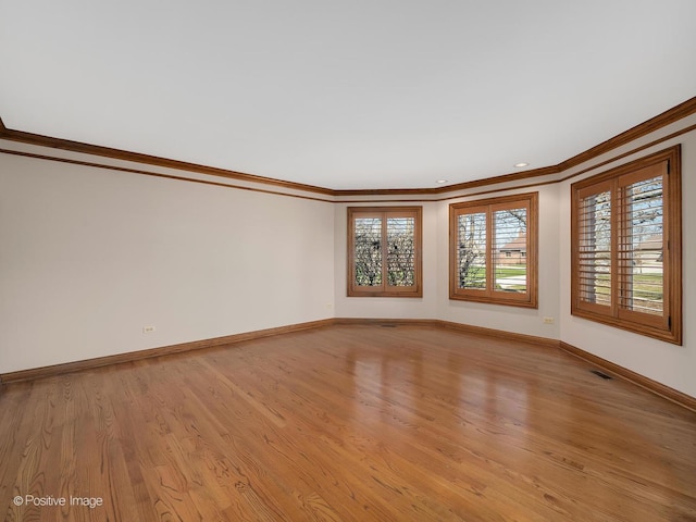 14320 Claridge Ct, Orland Park, IL 60462 - empty room with crown molding, visible vents, baseboards, and light wood-style flooring