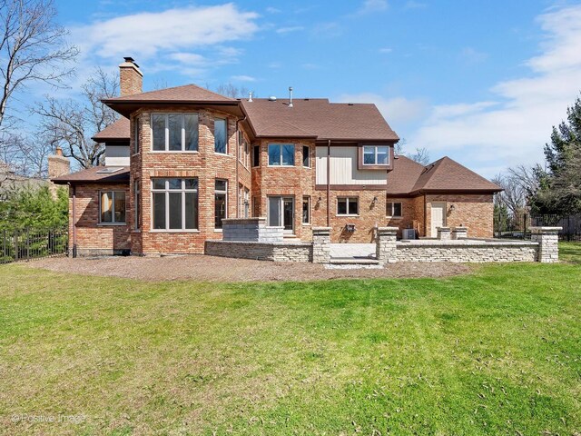 14320 Claridge Ct, Orland Park, IL 60462 - back of property with a patio, brick siding, a chimney, and a lawn