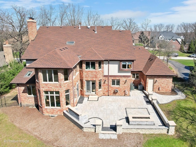 14320 Claridge Ct, Orland Park, IL 60462 - rear view of house with brick siding, fence, a patio, and a chimney