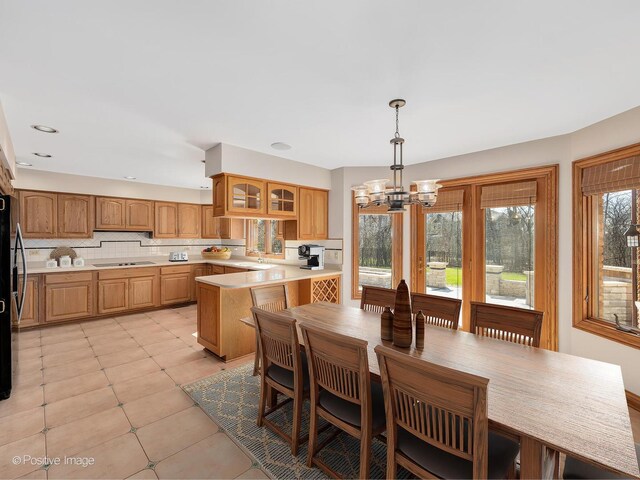 14320 Claridge Ct, Orland Park, IL 60462 - dining space with an inviting chandelier and light tile patterned floors