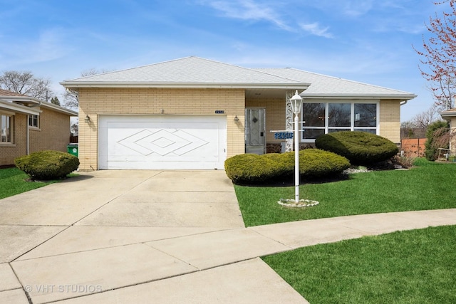 ranch-style home featuring a garage, concrete driveway, brick siding, a front lawn, and roof with shingles