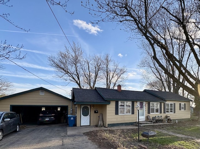 327 W Division, Amboy, IL 61310 - single story home with a chimney, driveway, and a garage