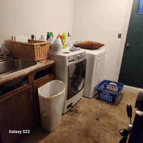 327 W Division, Amboy, IL 61310 - laundry room with cabinet space, separate washer and dryer, light carpet, and a sink