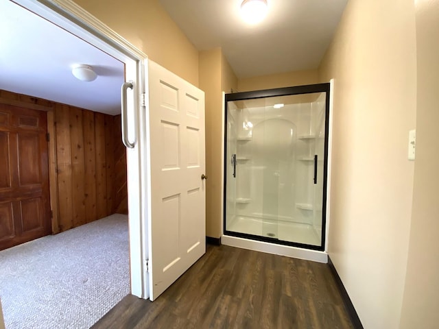 1657 Clay St, Woodstock, IL 60098 - bathroom featuring wood finished floors, a shower stall, and wooden walls