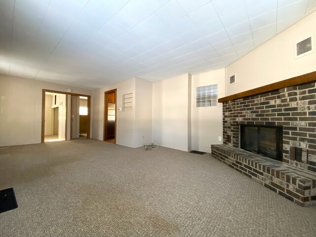 1657 Clay St, Woodstock, IL 60098 - unfurnished living room with a brick fireplace and carpet floors