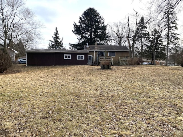 1657 Clay St, Woodstock, IL 60098 - back of property featuring a deck and a chimney