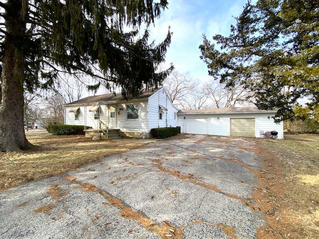 1657 Clay St, Woodstock, IL 60098 - view of property exterior featuring a garage and an outdoor structure