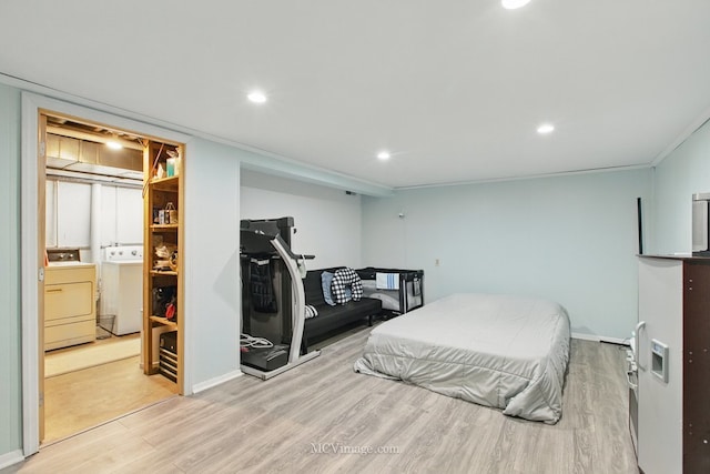 bedroom with recessed lighting, ornamental molding, washing machine and dryer, light wood-style floors, and baseboards