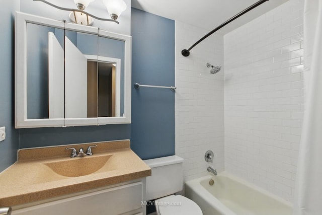 bathroom with toilet, vanity, and shower / bath combo with shower curtain
