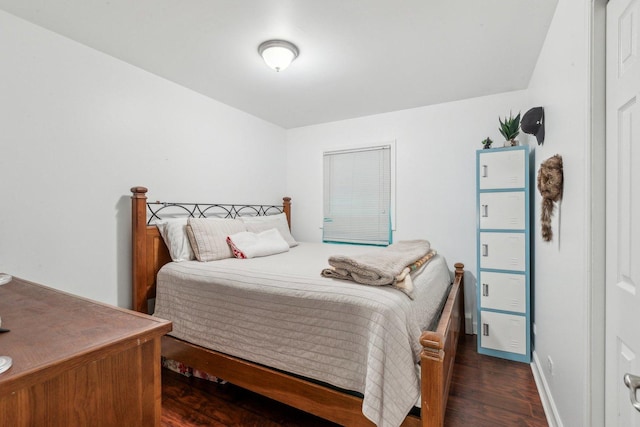bedroom with wood finished floors