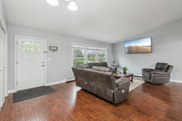 living room featuring hardwood / wood-style floors, healthy amount of natural light, a baseboard radiator, baseboards, and vaulted ceiling