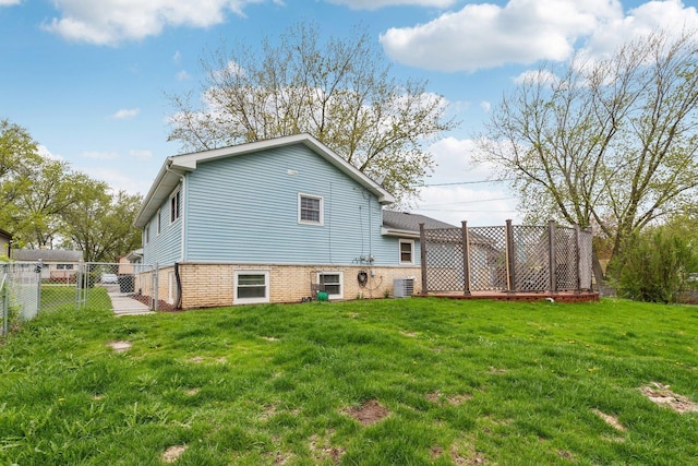 back of house featuring a gate