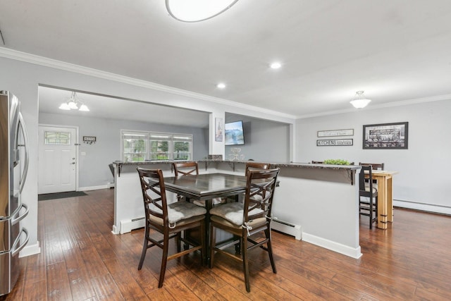 dining space featuring crown molding, a baseboard heating unit, dark wood finished floors, baseboards, and recessed lighting