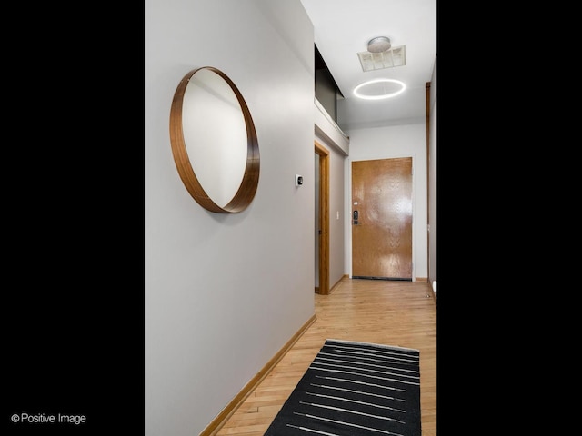 3323 N Paulina St Unit 5F, Chicago, IL 60657 - hall with light wood-style floors and baseboards