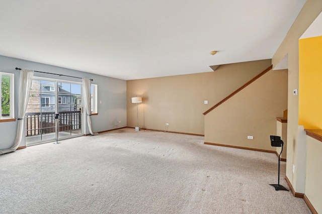 6422 W 65th St, Chicago, IL 60638 - unfurnished living room featuring baseboards, carpet flooring, and stairs