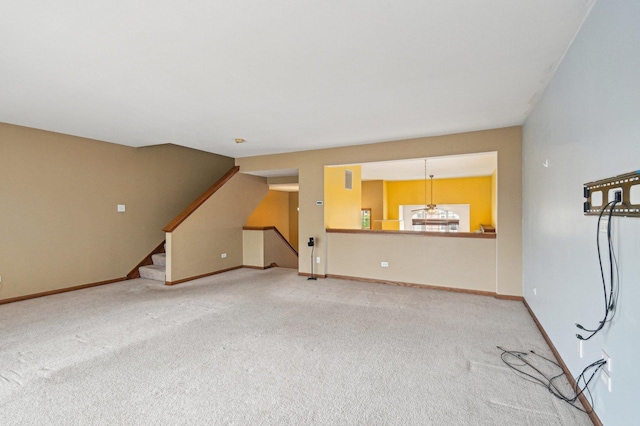 6422 W 65th St, Chicago, IL 60638 - unfurnished living room with baseboards, carpet, and stairway