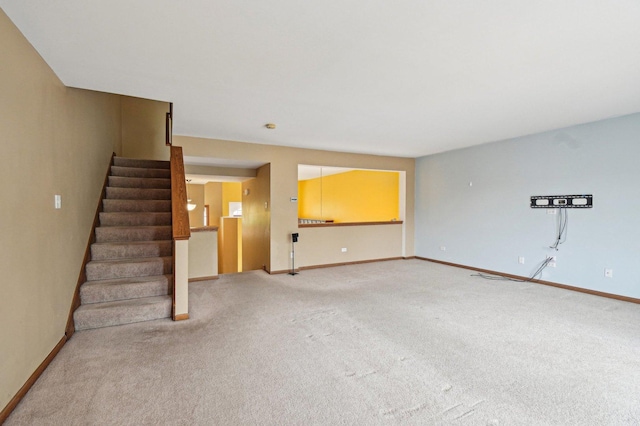 6422 W 65th St, Chicago, IL 60638 - unfurnished living room featuring light colored carpet, baseboards, and stairway