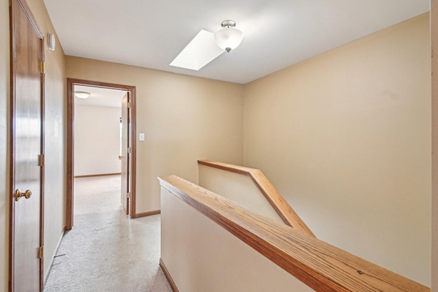 6422 W 65th St, Chicago, IL 60638 - corridor with light colored carpet, baseboards, a skylight, and an upstairs landing