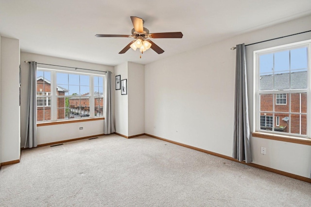 6422 W 65th St, Chicago, IL 60638 - spare room featuring plenty of natural light, carpet flooring, baseboards, and a ceiling fan