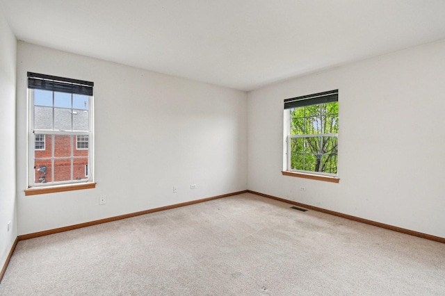 6422 W 65th St, Chicago, IL 60638 - empty room featuring baseboards, light colored carpet, and visible vents