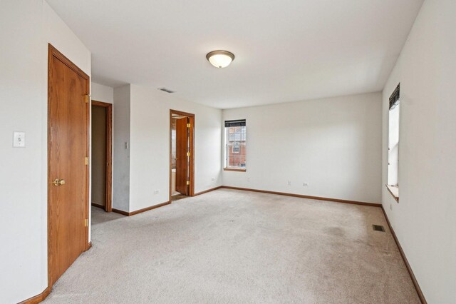 6422 W 65th St, Chicago, IL 60638 - spare room with light colored carpet, baseboards, and visible vents
