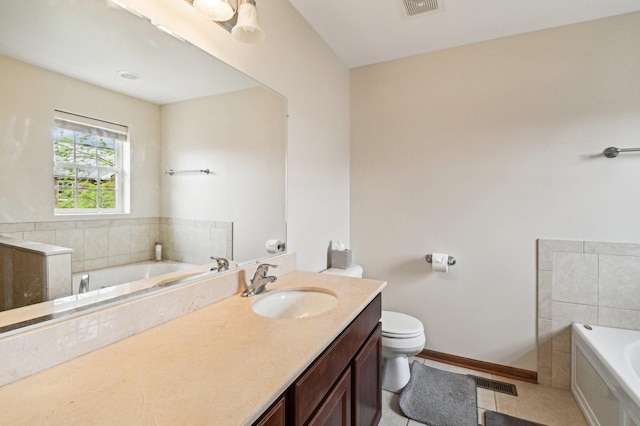 6422 W 65th St, Chicago, IL 60638 - full bathroom featuring a garden tub, tile patterned flooring, visible vents, vanity, and toilet