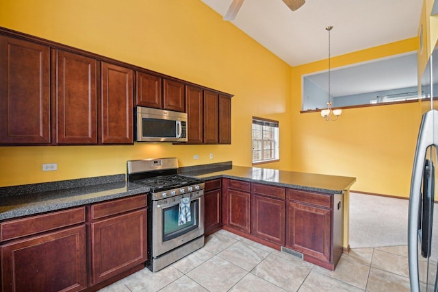 6422 W 65th St, Chicago, IL 60638 - kitchen featuring visible vents, a peninsula, light tile patterned floors, hanging light fixtures, and stainless steel appliances