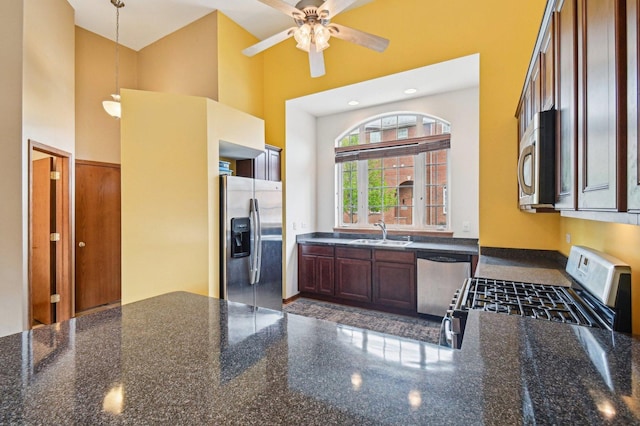 6422 W 65th St, Chicago, IL 60638 - kitchen with ceiling fan, a towering ceiling, appliances with stainless steel finishes, a sink, and dark stone countertops
