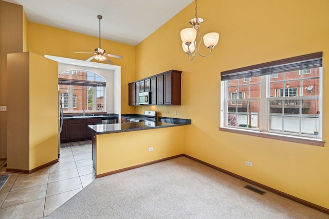 6422 W 65th St, Chicago, IL 60638 - kitchen featuring visible vents, appliances with stainless steel finishes, a sink, high vaulted ceiling, and a peninsula