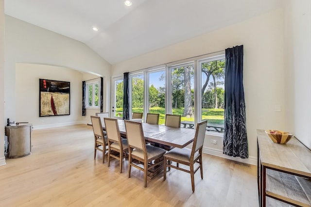 dining room featuring light wood-style flooring, visible vents, recessed lighting, lofted ceiling, and baseboards