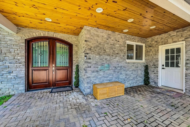 entrance to property with stone siding