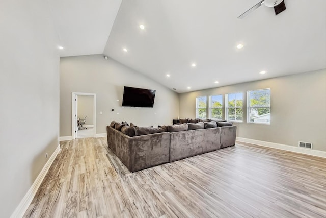 living area with recessed lighting, lofted ceiling, visible vents, and wood finished floors