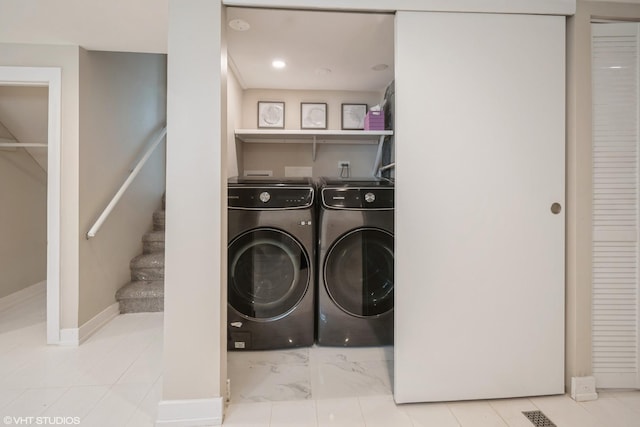 8518 S Avalon Ave, Chicago, IL 60619 - washroom with washer and clothes dryer and baseboards