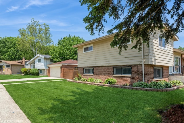8518 S Avalon Ave, Chicago, IL 60619 - split level home with a garage, a front yard, an outdoor structure, and brick siding