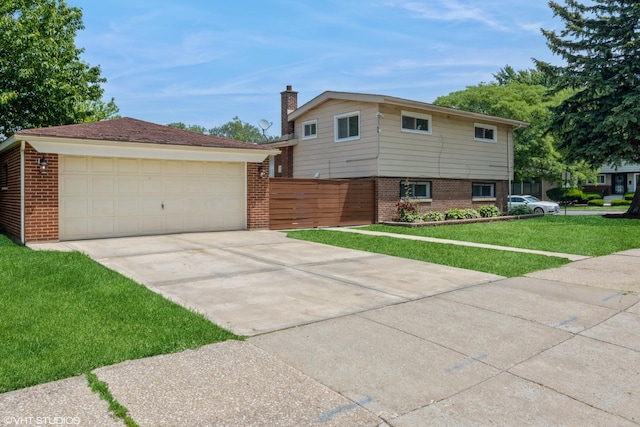 8518 S Avalon Ave, Chicago, IL 60619 - split level home with a chimney, brick siding, and a garage