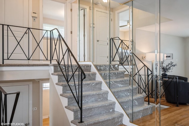 8518 S Avalon Ave, Chicago, IL 60619 - staircase featuring wood finished floors, healthy amount of natural light, and a ceiling fan