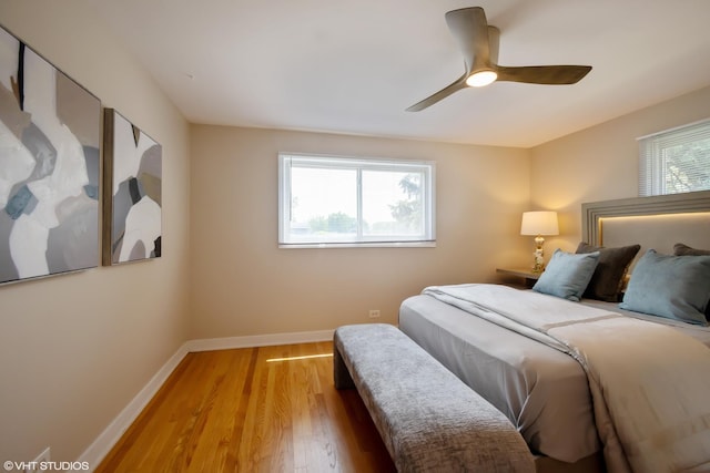 8518 S Avalon Ave, Chicago, IL 60619 - bedroom featuring baseboards, light wood-style floors, and a ceiling fan