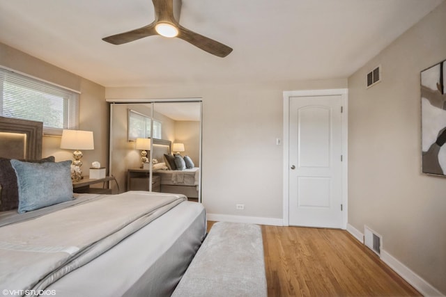 8518 S Avalon Ave, Chicago, IL 60619 - bedroom with wood finished floors, a closet, baseboards, and a ceiling fan