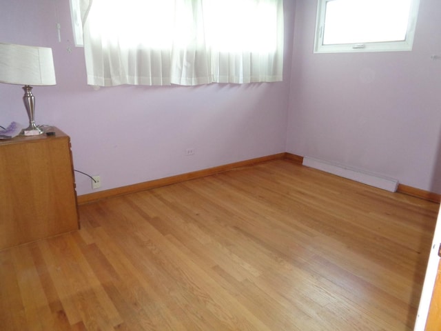 4603 Rose St, Schiller Park, IL 60176 - unfurnished room featuring baseboards and wood finished floors