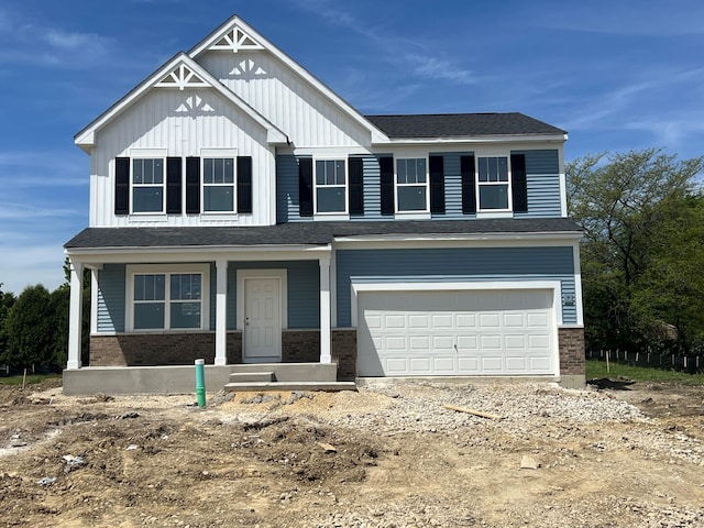 908 Fair Meadow St, North Aurora, IL 60542 - view of front of house with an attached garage, brick siding, board and batten siding, and dirt driveway
