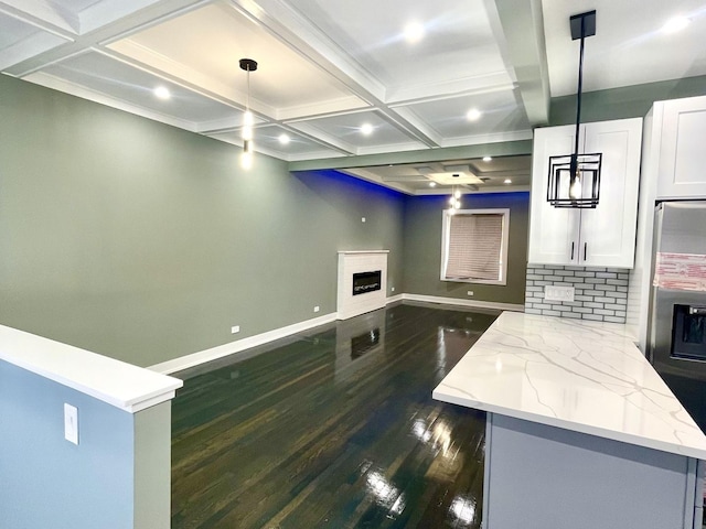 7042 S Eberhart Ave, Chicago, IL 60637 - kitchen with dark wood-type flooring, coffered ceiling, light stone counters, a fireplace, and beam ceiling