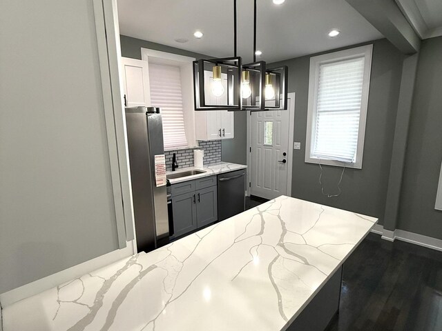 7042 S Eberhart Ave, Chicago, IL 60637 - kitchen featuring freestanding refrigerator, dishwashing machine, decorative backsplash, light stone counters, and recessed lighting