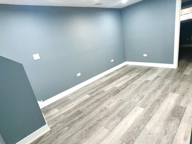 7042 S Eberhart Ave, Chicago, IL 60637 - unfurnished room with wood finished floors and baseboards