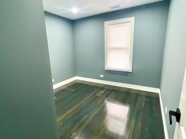 7042 S Eberhart Ave, Chicago, IL 60637 - empty room with baseboards and dark wood-style floors
